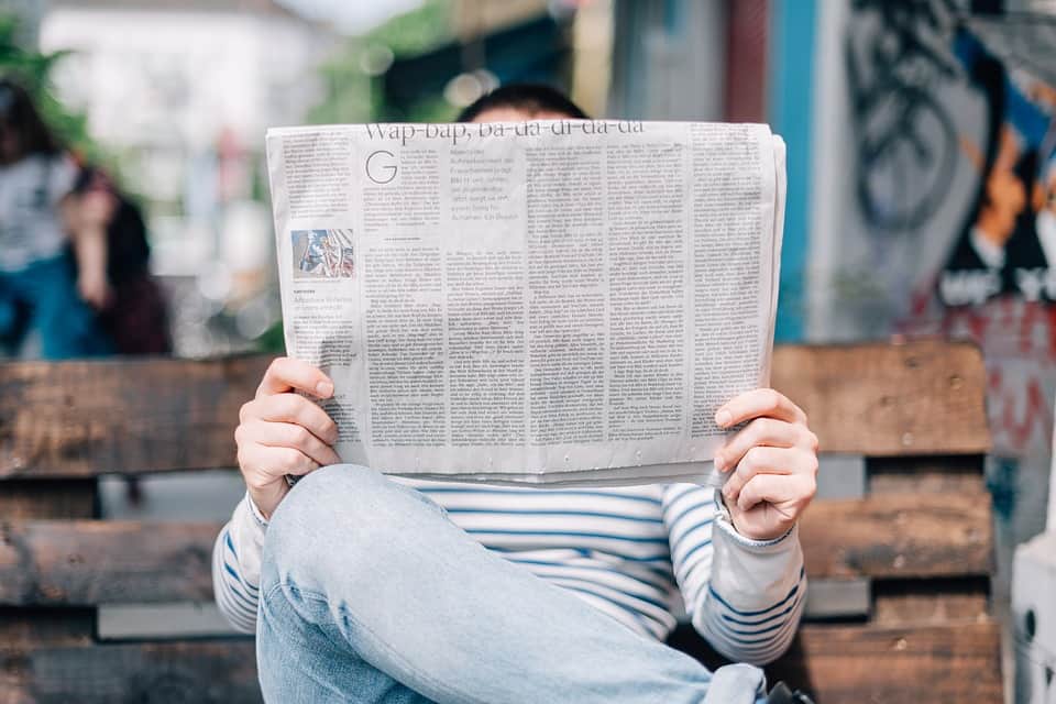 man-reading-newspaper