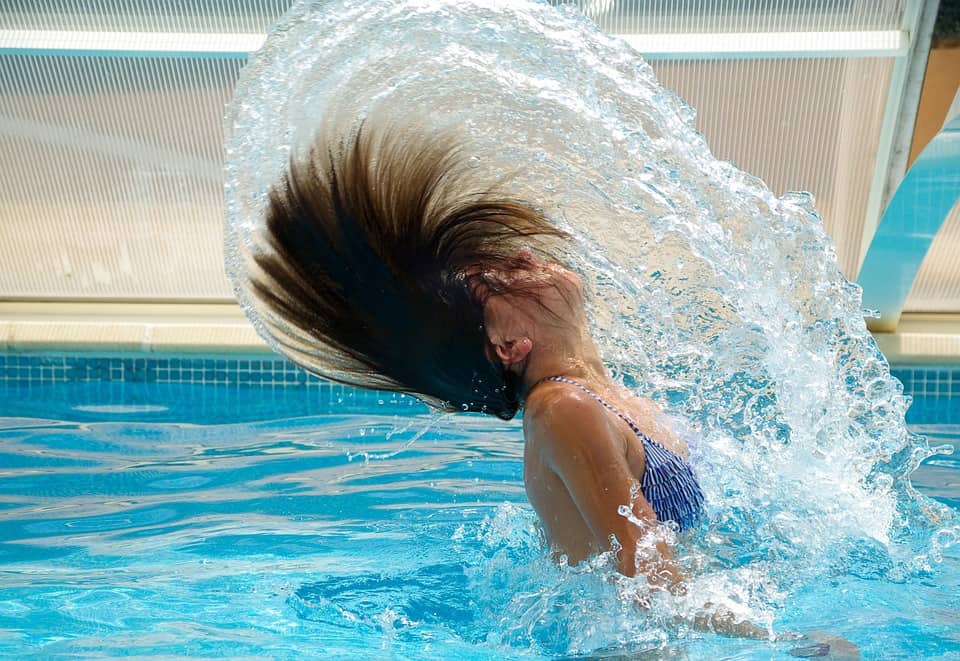 Woman-in-pool-flipping-hair