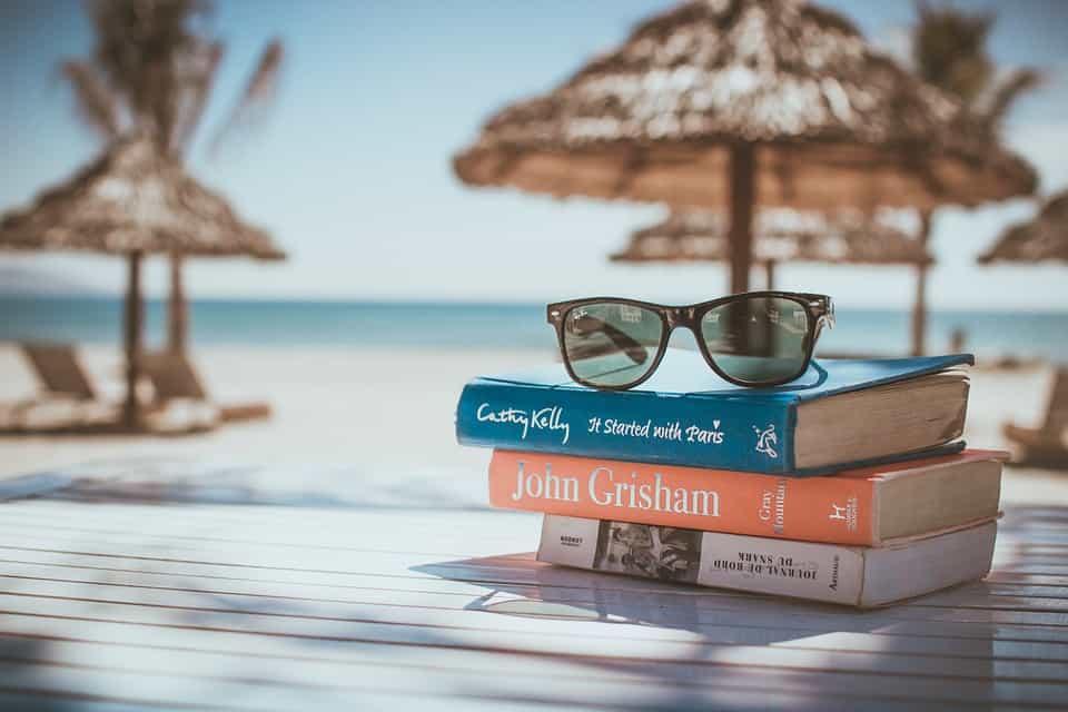 stack-of-books-on-a-beach