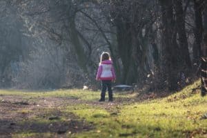 girl-child-standing-in-the-forest