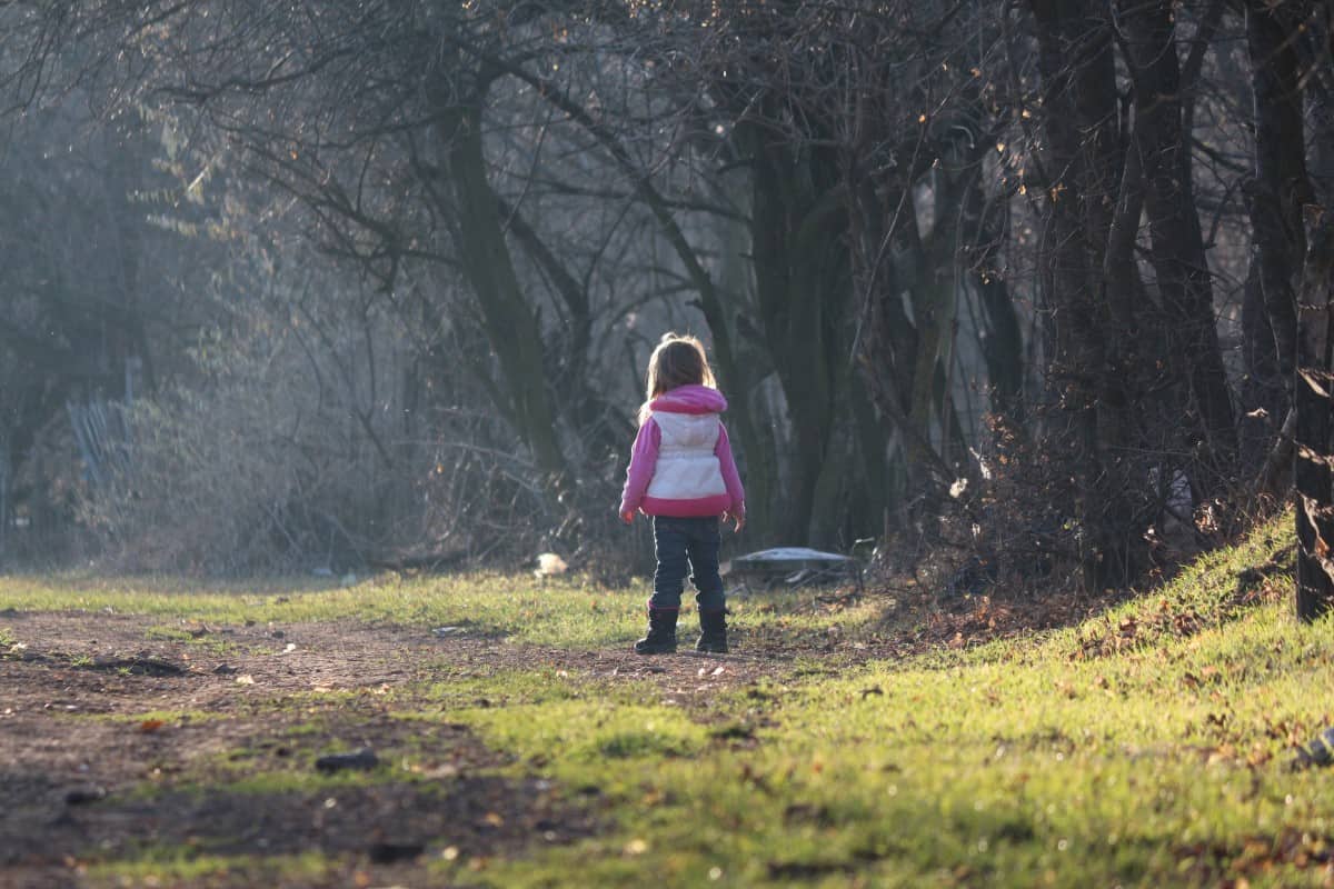 girl-child-standing-in-the-forest