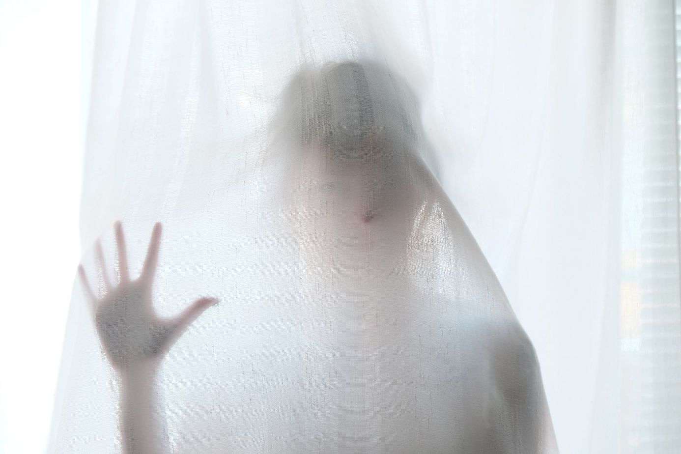 woman-behind-transparent-curtain